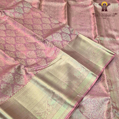 A charming soft baby pink shade beautifully blended with shimmering gold tissue Saree