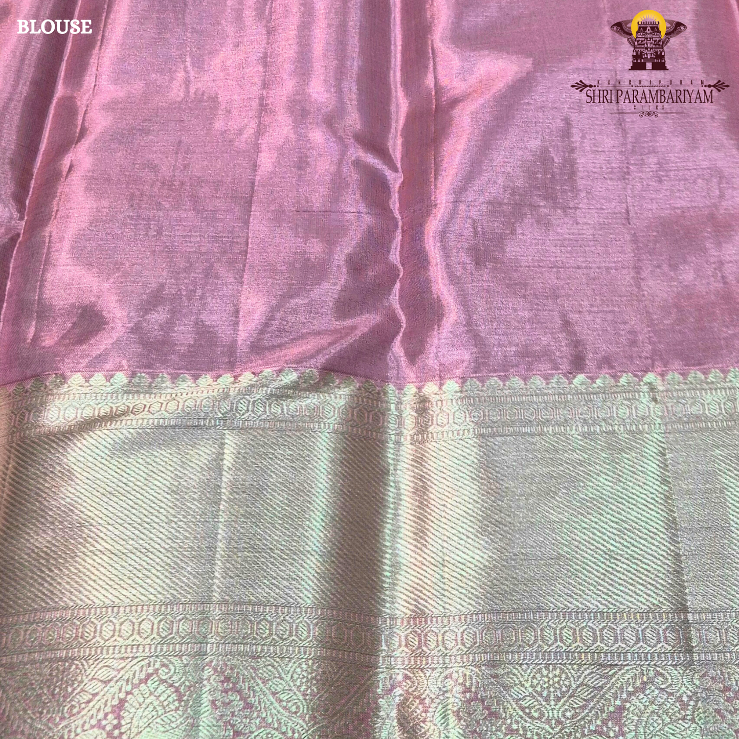 A charming soft baby pink shade beautifully blended with shimmering gold tissue Saree