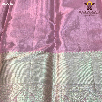 A charming soft baby pink shade beautifully blended with shimmering gold tissue Saree