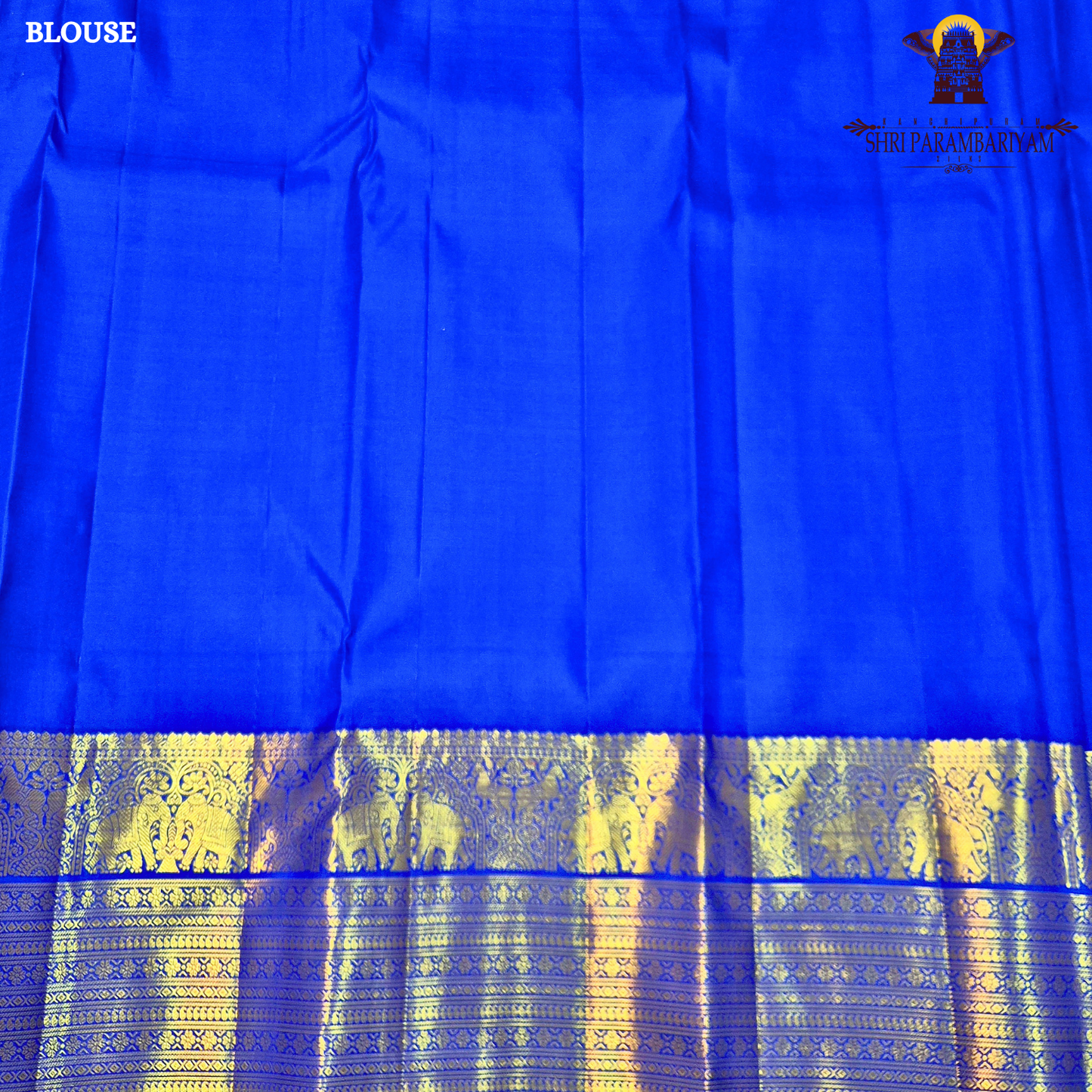 A vibrant Royal Blue with Antique Gold Zari Saree