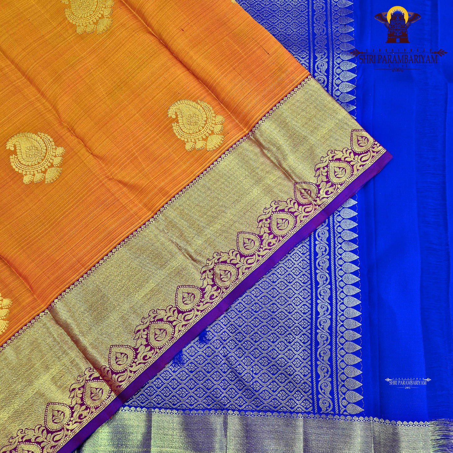 A rich Bright mango orange body with a rich gold zari Saree