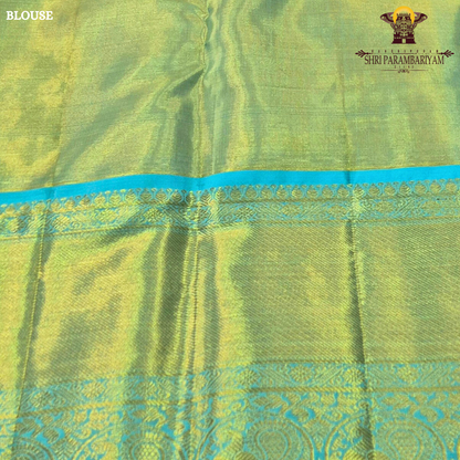 A soft peach / blush pink body paired with a contrasting aqua blue border Saree