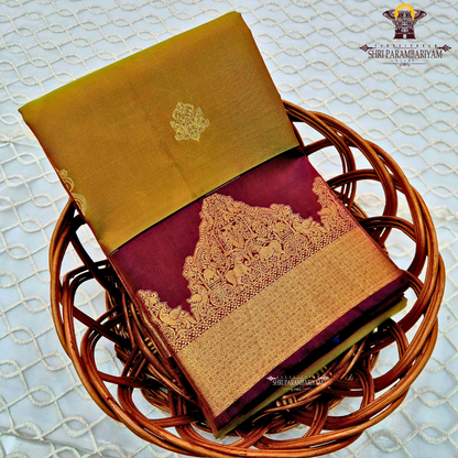 Rich mustard-gold body with deep maroon contrast pallu and antique gold zari Saree
