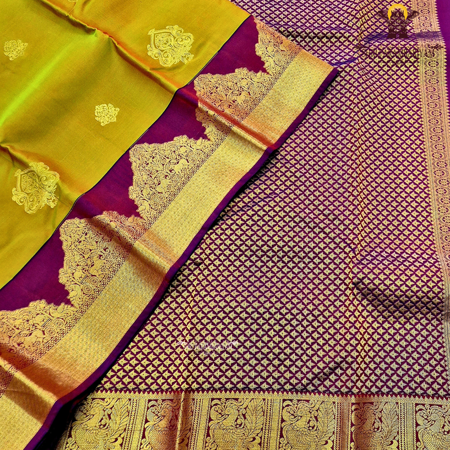 Rich mustard-gold body with deep maroon contrast pallu and antique gold zari Saree