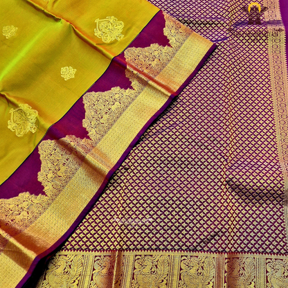 Rich mustard-gold body with deep maroon contrast pallu and antique gold zari Saree