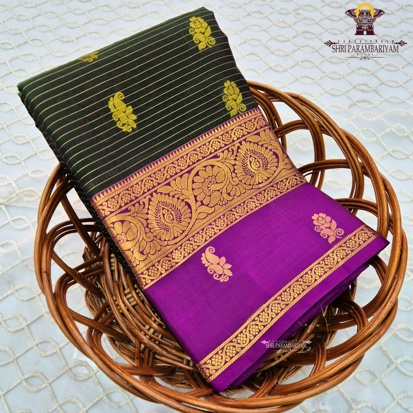 Deep bottle green body with rich royal purple contrast pallu and antique gold zari Saree