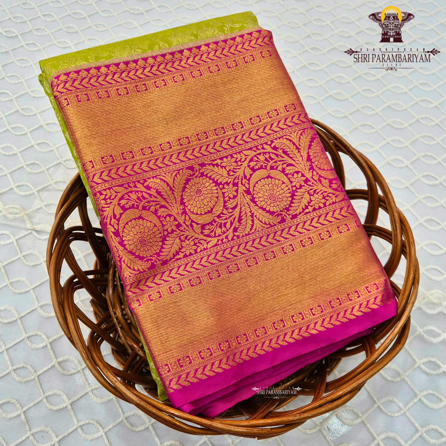 A refreshing parrot green body paired with a vibrant rani pink border Saree