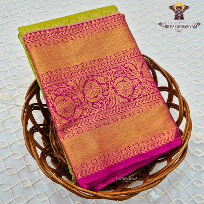 A refreshing parrot green body paired with a vibrant rani pink border Saree