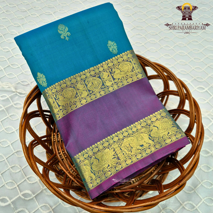 A turquoise Blue and Violet Purple with rich Gold Zari Saree