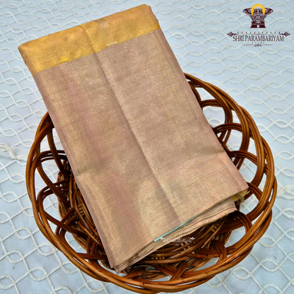 A delicate champagne gold with a subtle rose-gold tint Saree