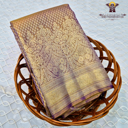 A rich Golden Tissue base with a soft Purple (Violet) border Saree