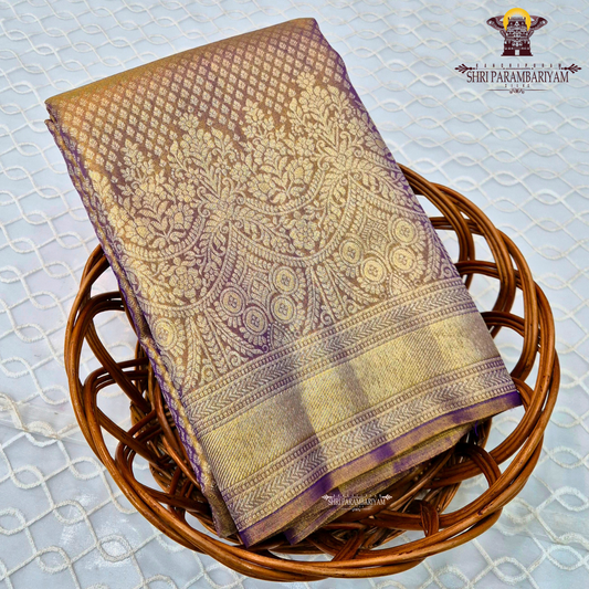 A rich Golden Tissue base with a soft Purple (Violet) border Saree