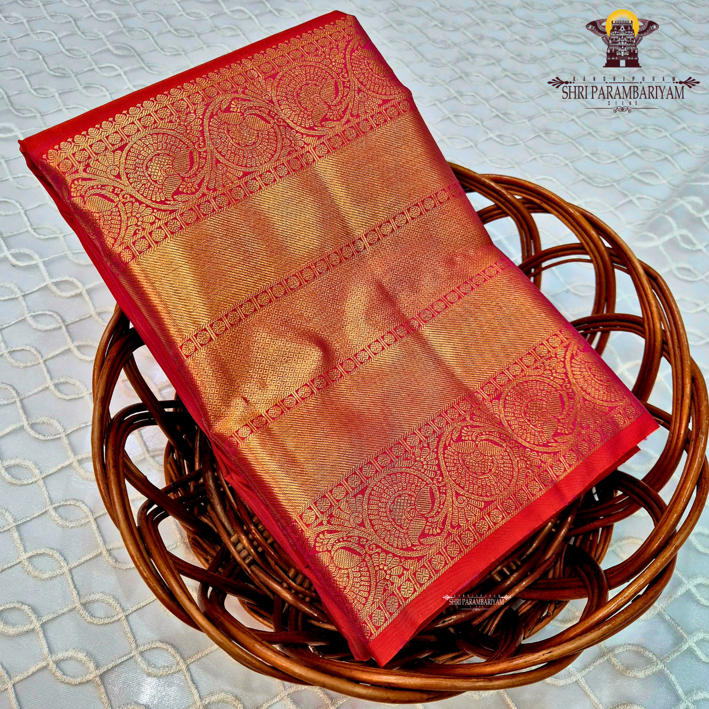 A rich Rani pink / Tomato Red with Antique Gold Zari Saree