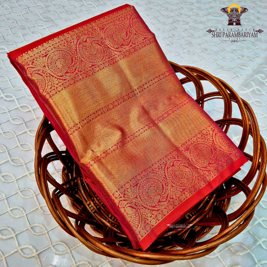 A rich Rani pink / Tomato Red with Antique Gold Zari Saree