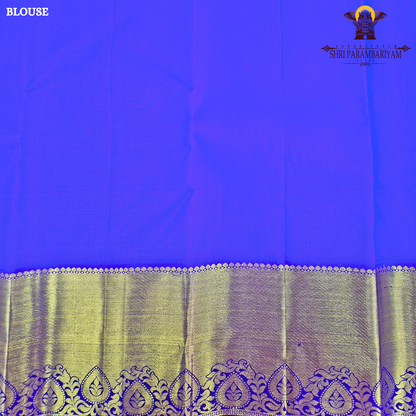 A rich Bright mango orange body with a rich gold zari Saree