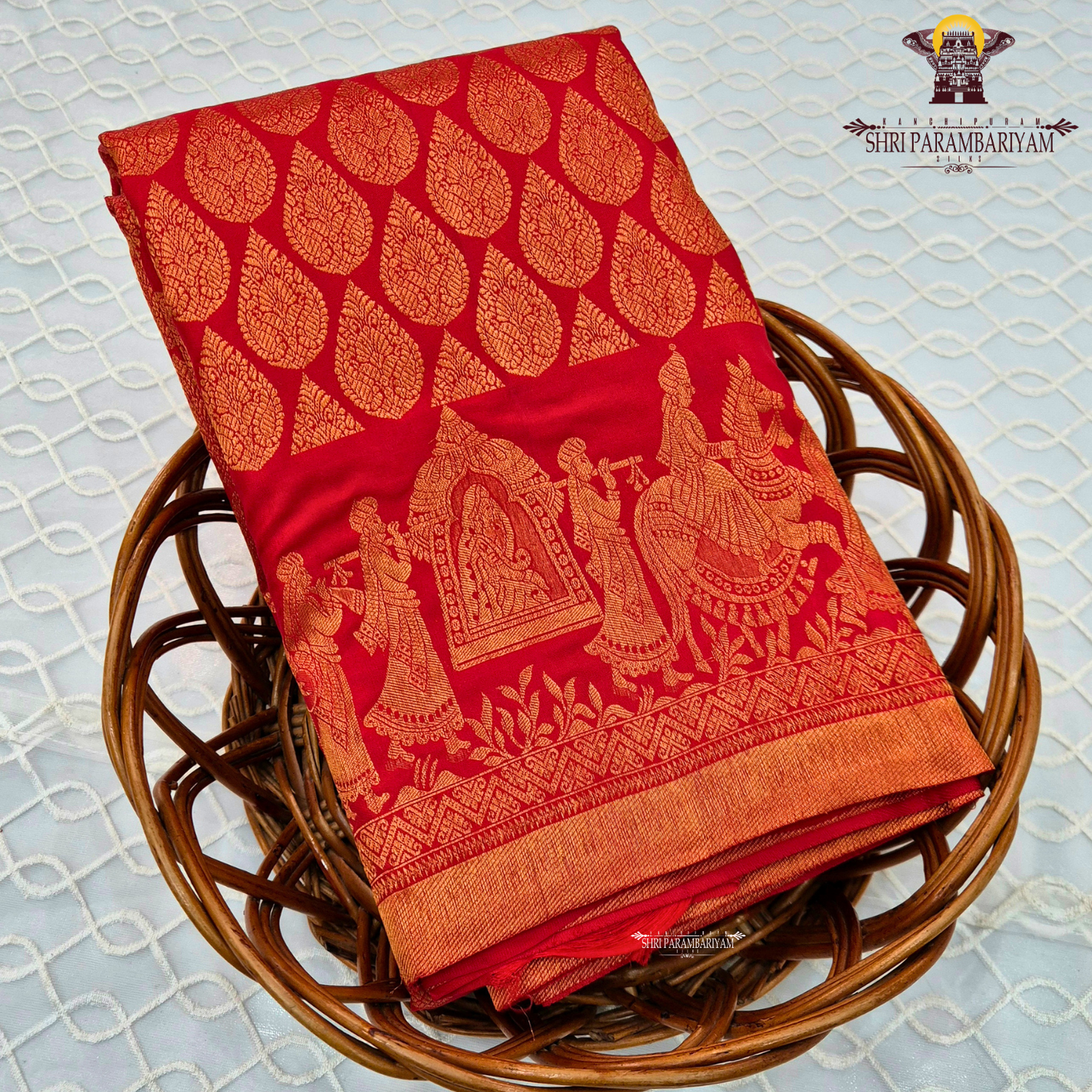 A vibrant bridal red color beautifully enhanced with rich gold zari weaving Saree