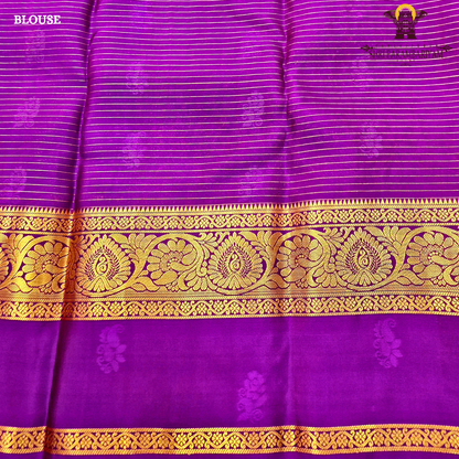 Deep bottle green body with rich royal purple contrast pallu and antique gold zari Saree