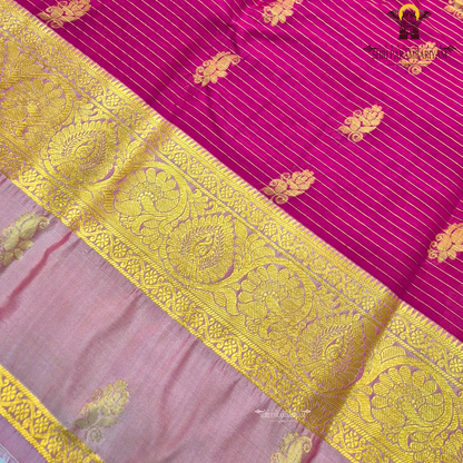 Rich magenta pink body with light pastel pink contrast pallu and antique gold zari Saree