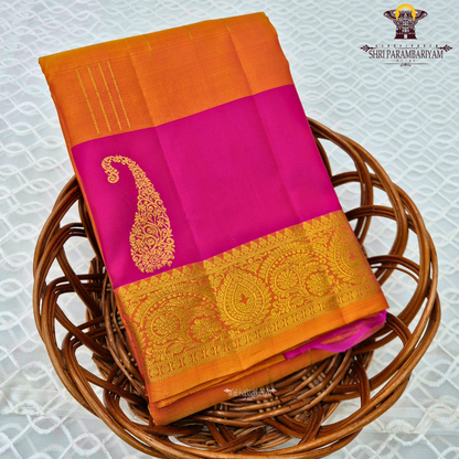 Vibrant rani pink and rich turmeric orange, beautifully enhanced Saree