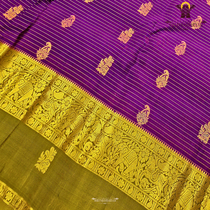 Royal purple body with olive green contrast pallu and rich antique gold zari Saree