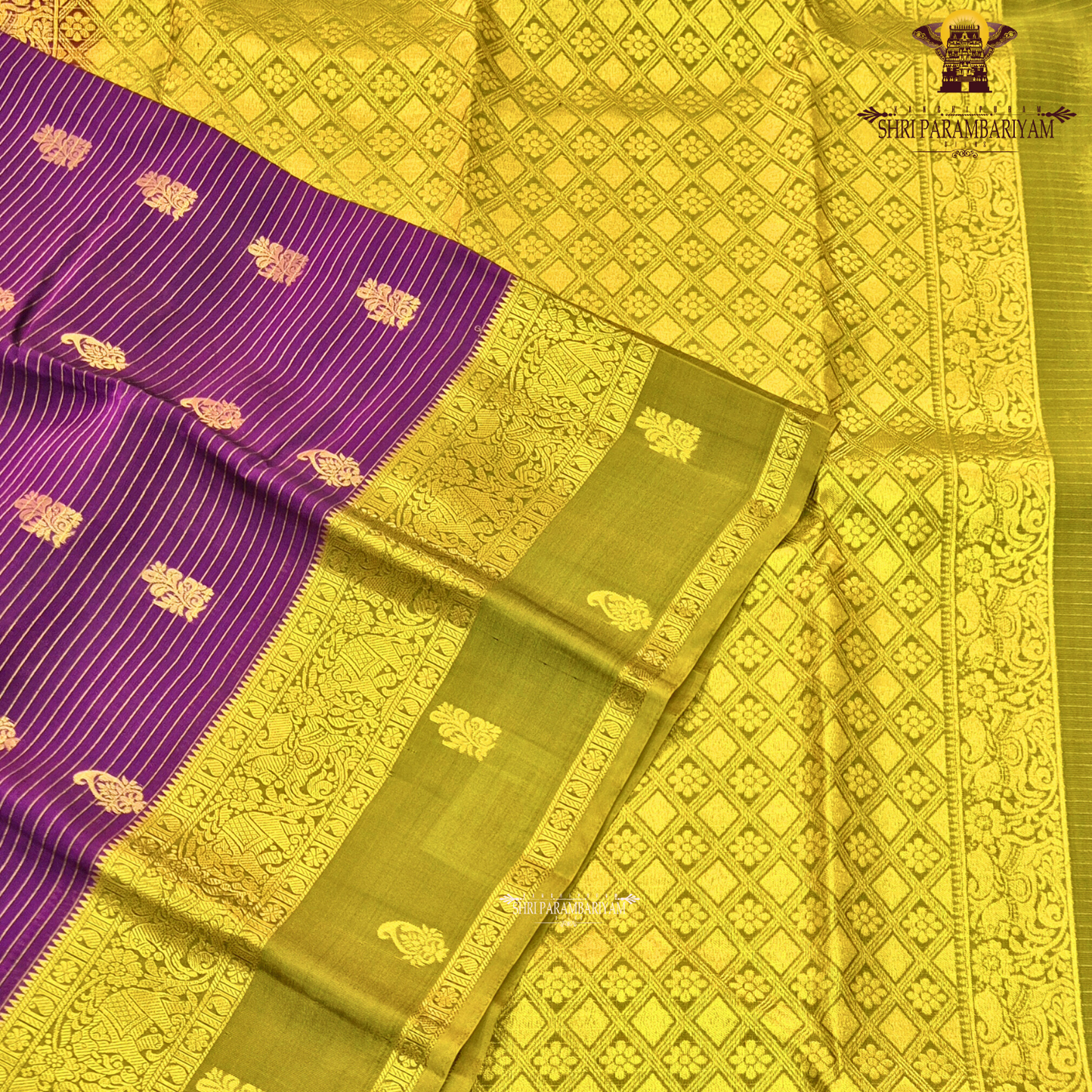 Royal purple body with olive green contrast pallu and rich antique gold zari Saree