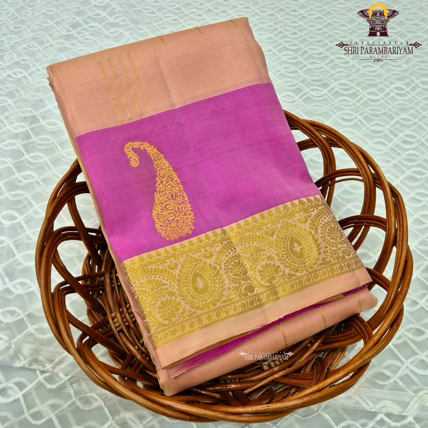 A graceful combination of soft peach and vibrant rani pink, enriched with elegant Saree