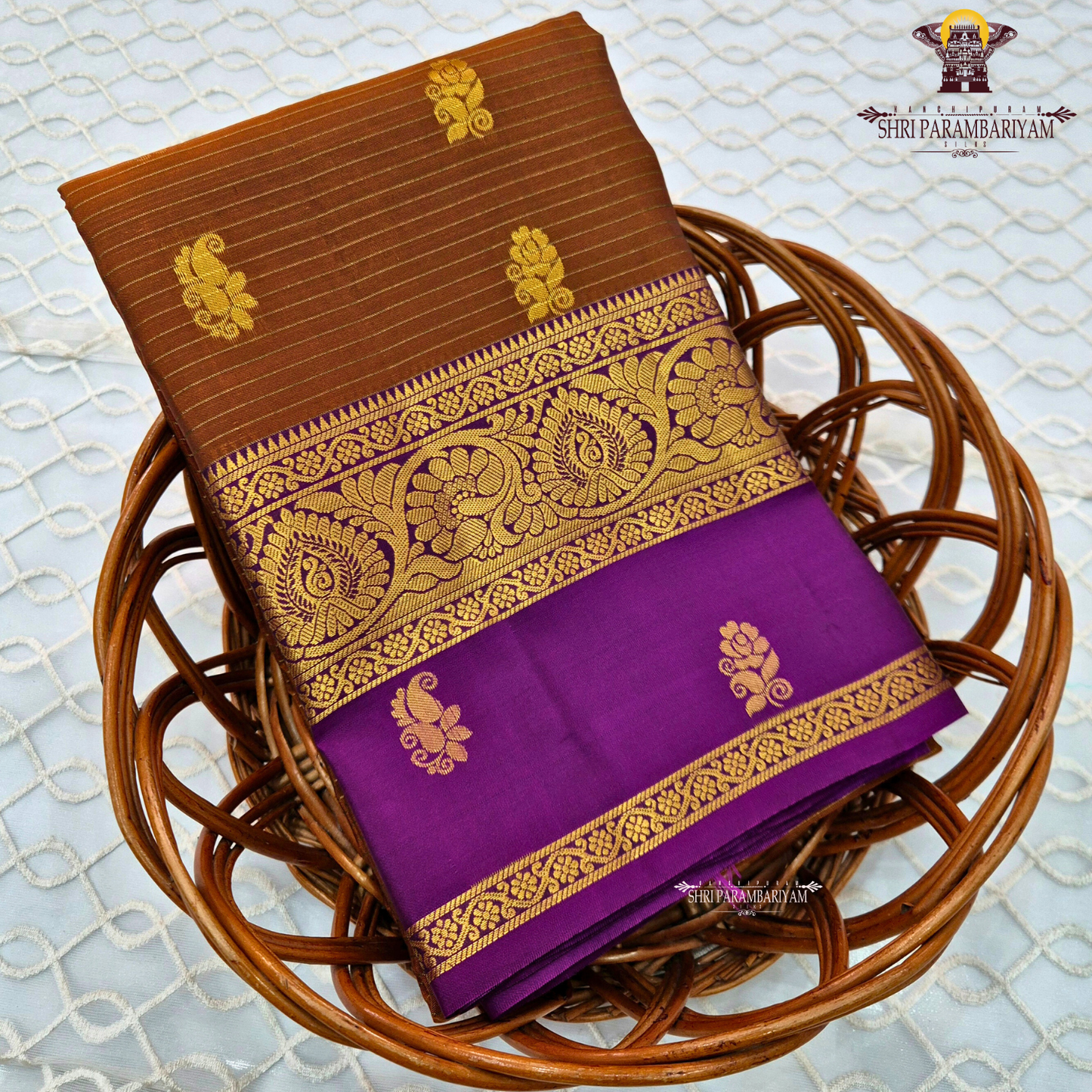 Rich coffee brown body with royal purple contrast pallu and antique gold zari Saree