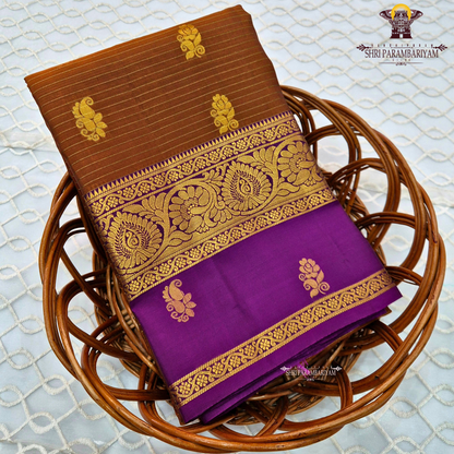 Rich coffee brown body with royal purple contrast pallu and antique gold zari Saree