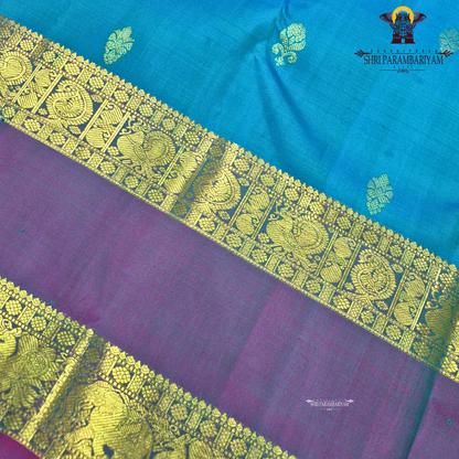 A turquoise Blue and Violet Purple with rich Gold Zari Saree