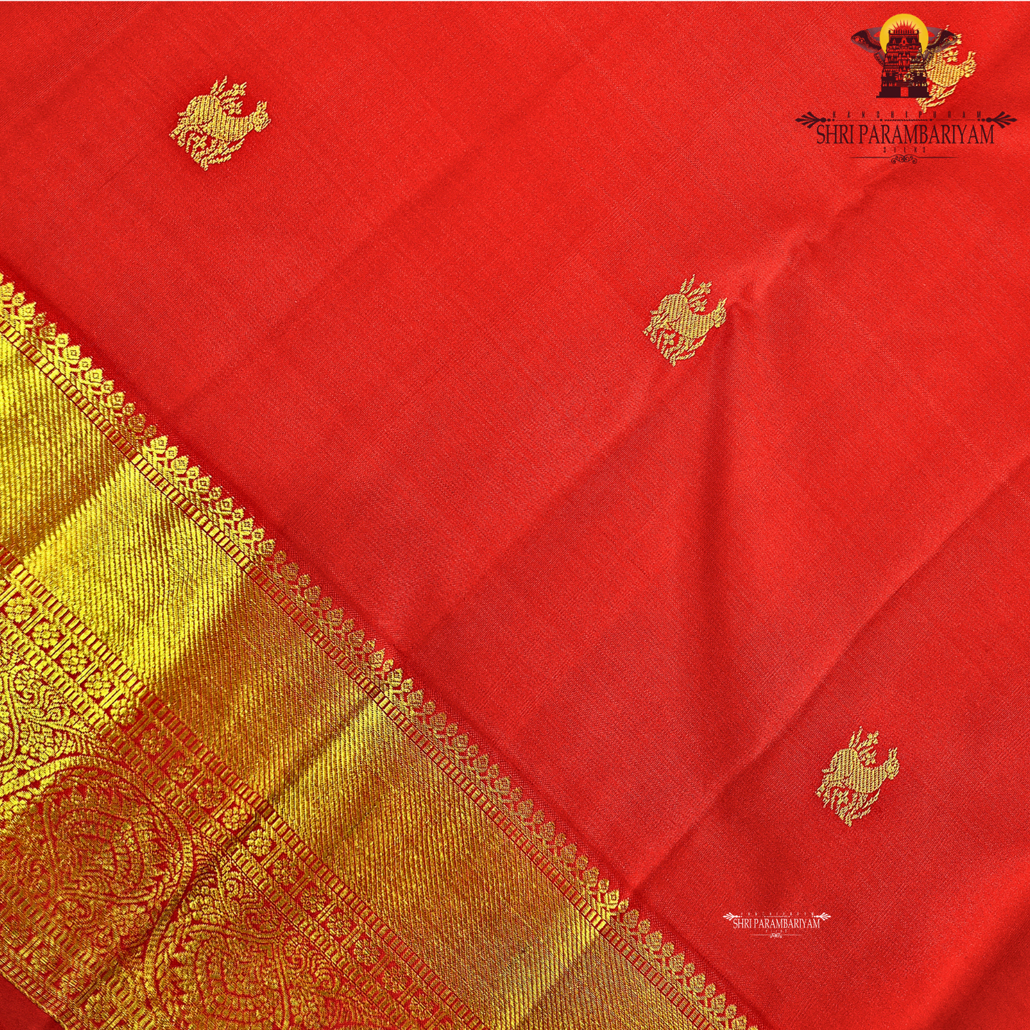 A rich bright vermilion red Saree