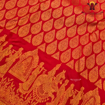 A vibrant bridal red color beautifully enhanced with rich gold zari weaving Saree