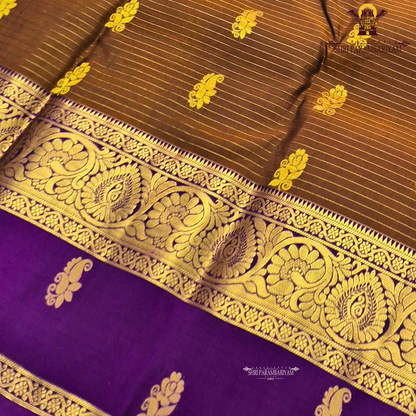 Rich coffee brown body with royal purple contrast pallu and antique gold zari Saree