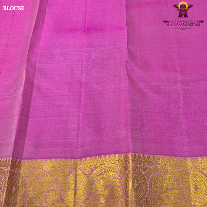 A graceful combination of soft peach and vibrant rani pink, enriched with elegant Saree