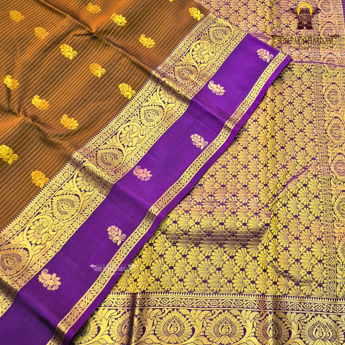 Rich coffee brown body with royal purple contrast pallu and antique gold zari Saree