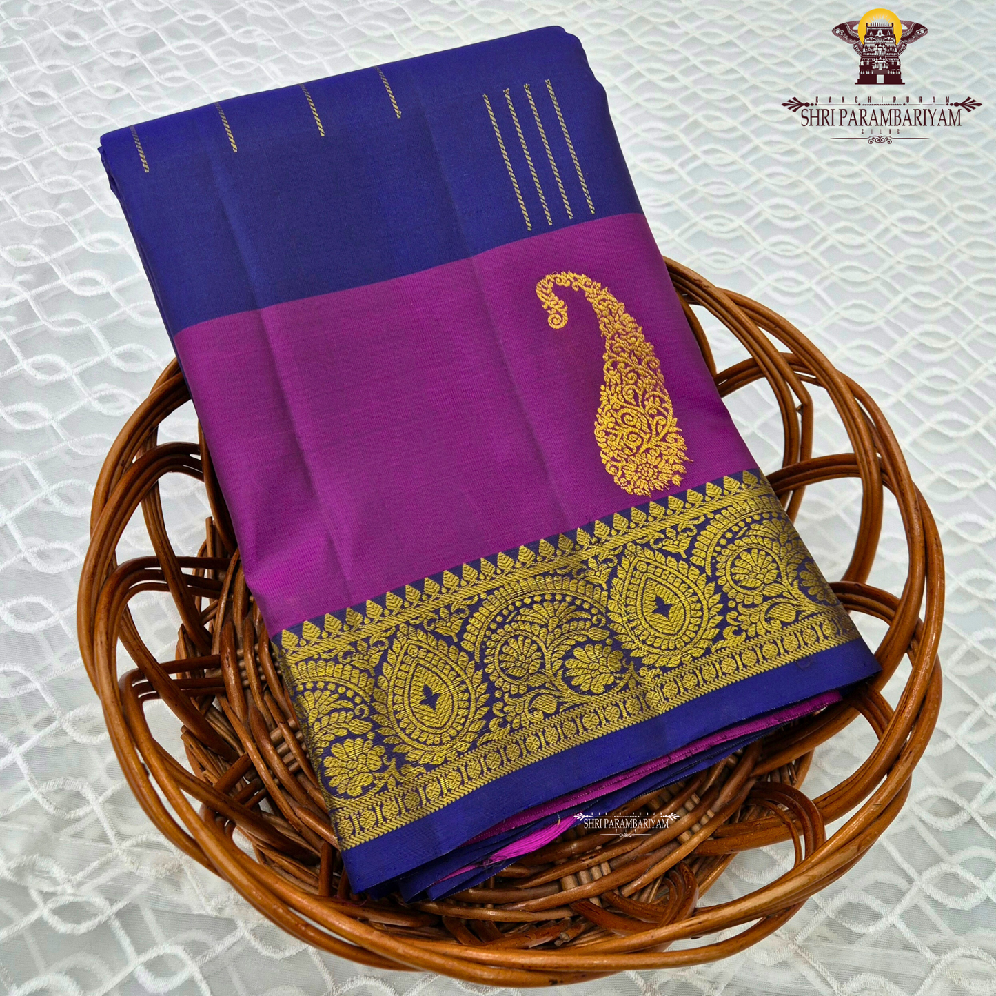 A rich royal blue body beautifully contrasted with a vibrant magenta Saree