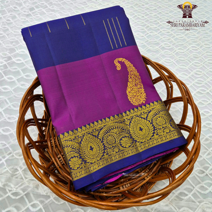 A rich royal blue body beautifully contrasted with a vibrant magenta Saree