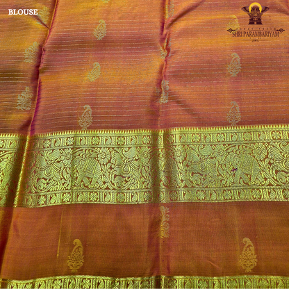 Deep royal purple body with rust orange contrast pallu and rich antique gold zari Saree