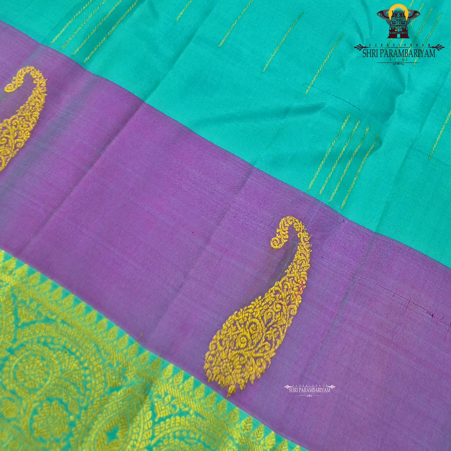 A refreshing turquoise green body paired with a soft lavender-purple contrast Saree