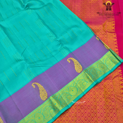 A refreshing turquoise green body paired with a soft lavender-purple contrast Saree