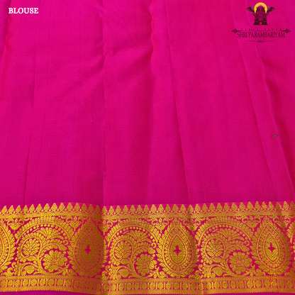 A refreshing turquoise green body paired with a soft lavender-purple contrast Saree