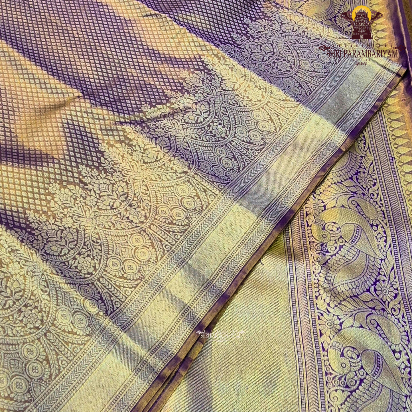 A rich Golden Tissue base with a soft Purple (Violet) border Saree