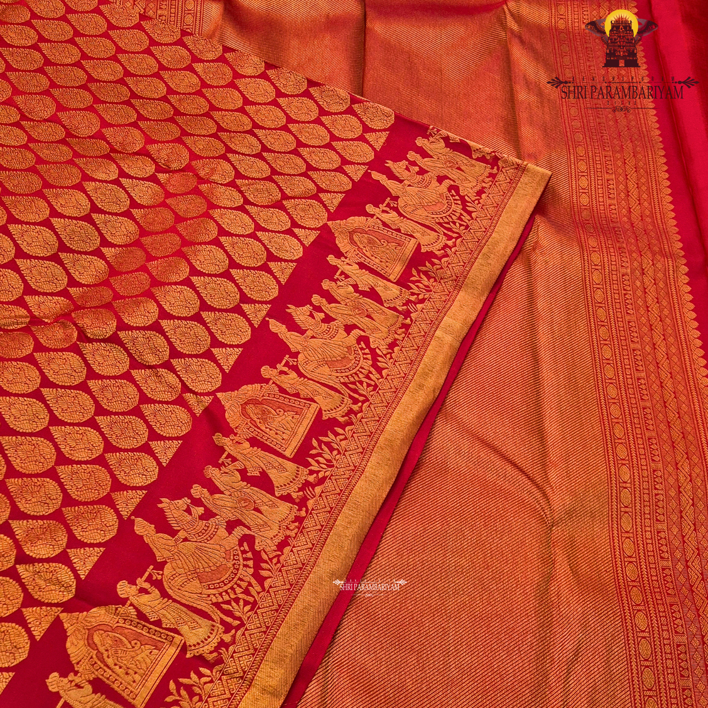A vibrant bridal red color beautifully enhanced with rich gold zari weaving Saree