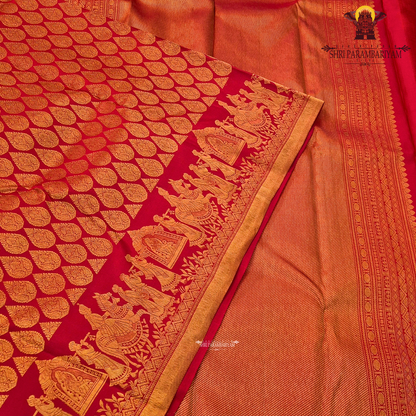 A vibrant bridal red color beautifully enhanced with rich gold zari weaving Saree