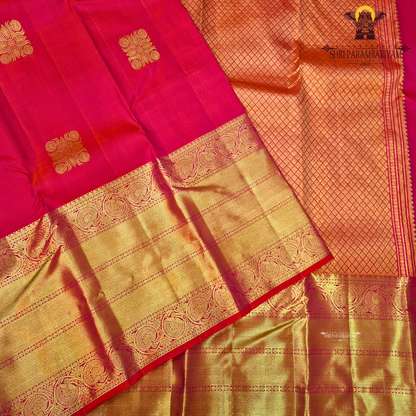 A rich Rani pink / Tomato Red with Antique Gold Zari Saree