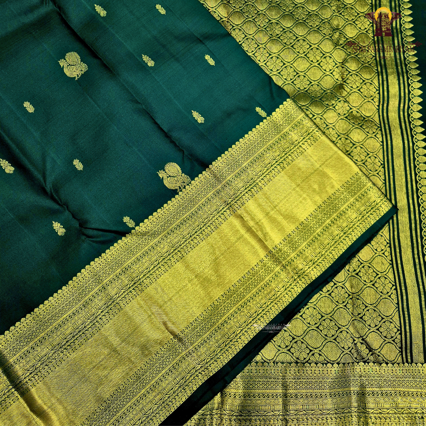 A captivating Deep Bottle Green / Dark Teal Green shade, beautifully complemented Saree