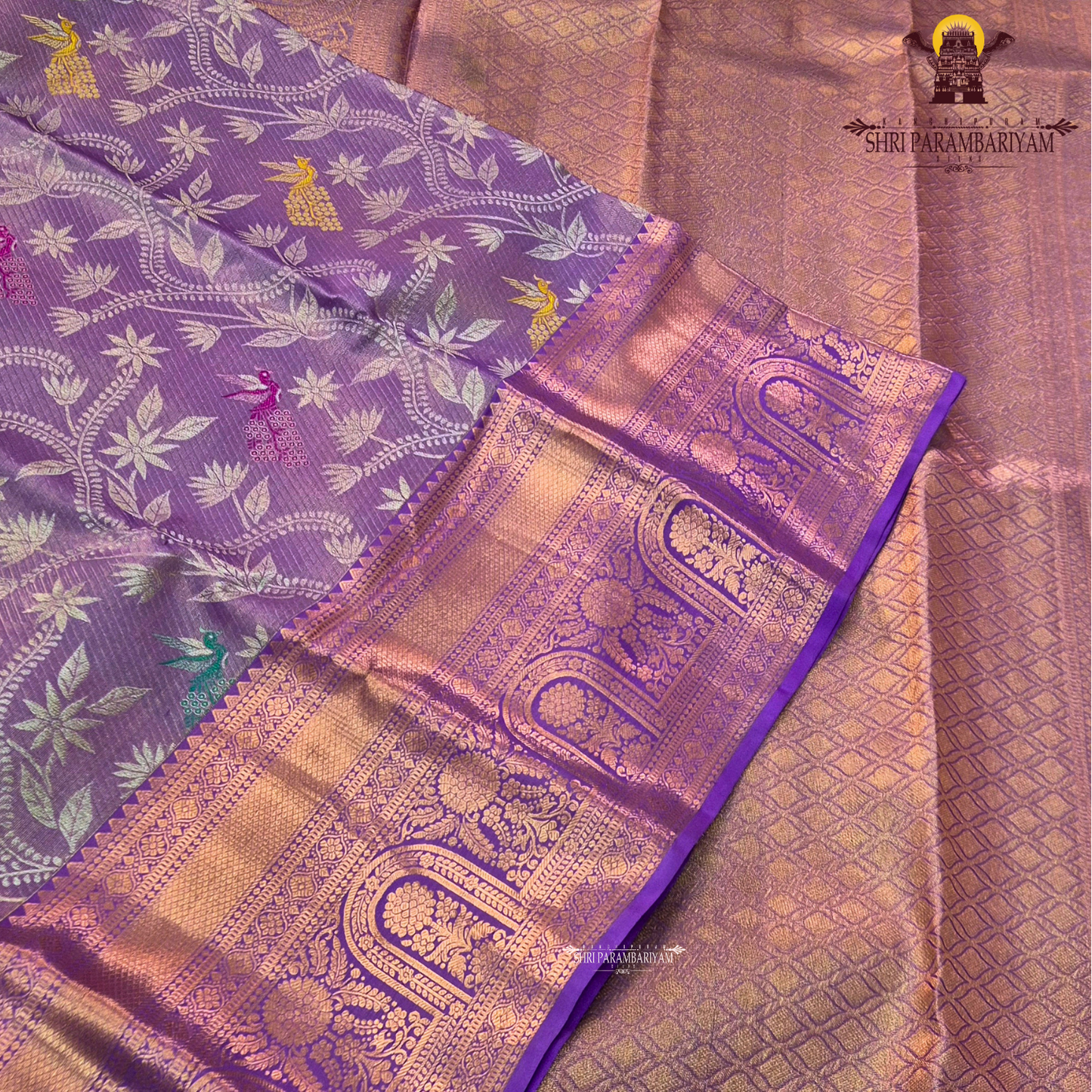 Soft lavender purple with rich gold zari and meenakari accents Saree