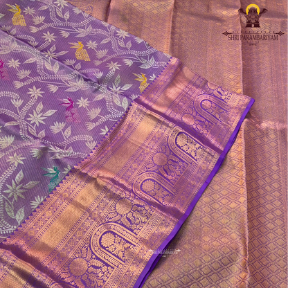 Soft lavender purple with rich gold zari and meenakari accents Saree
