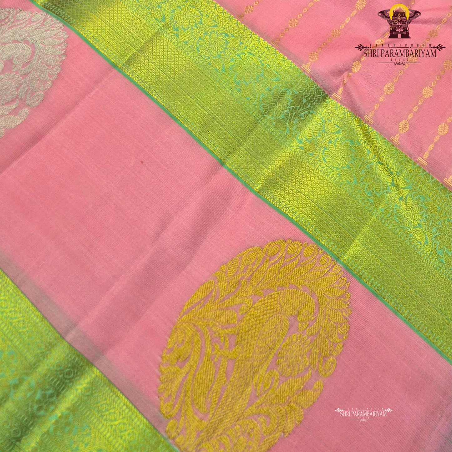 A graceful soft pink body complemented by a rich parrot green contrast border Saree