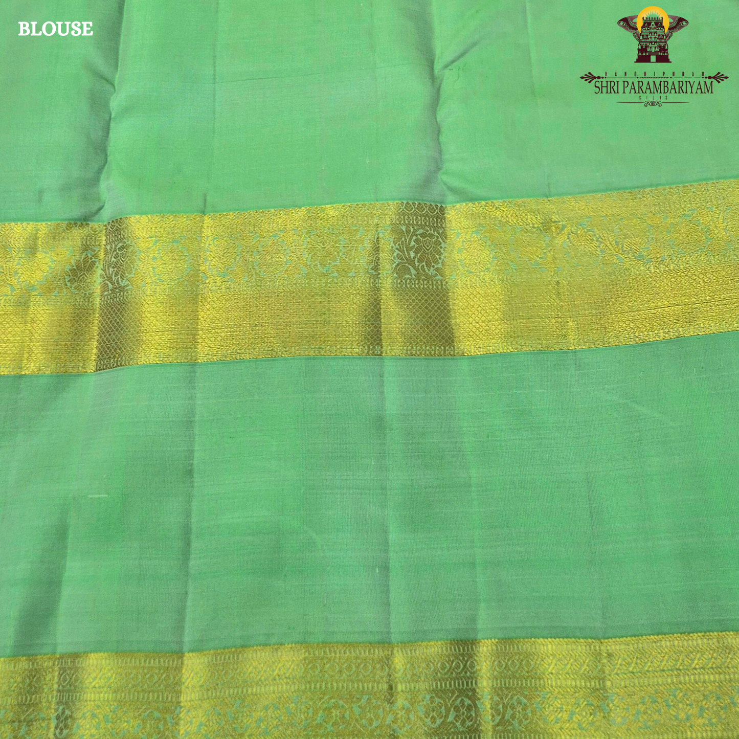 A graceful soft pink body complemented by a rich parrot green contrast border Saree