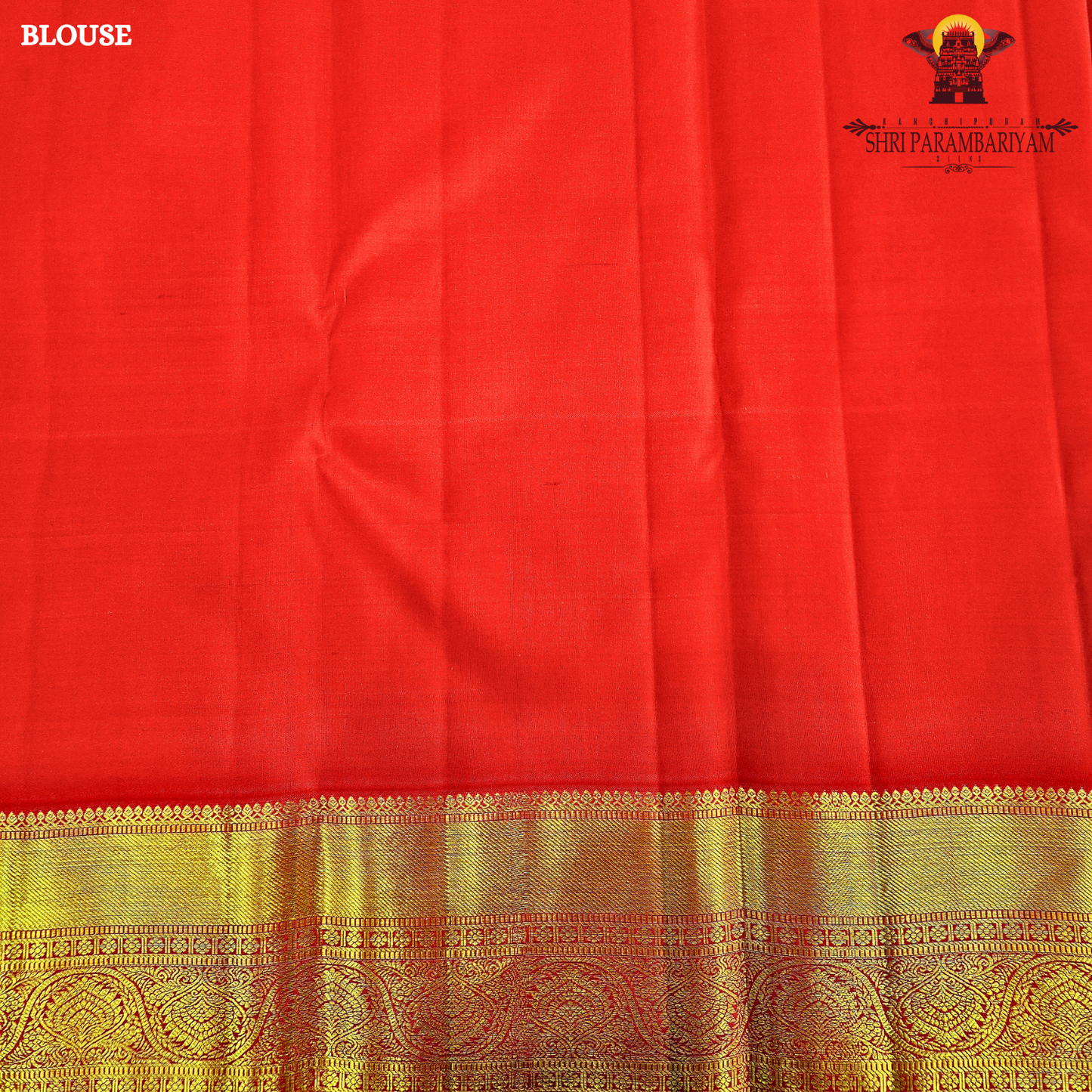 A rich bright vermilion red Saree